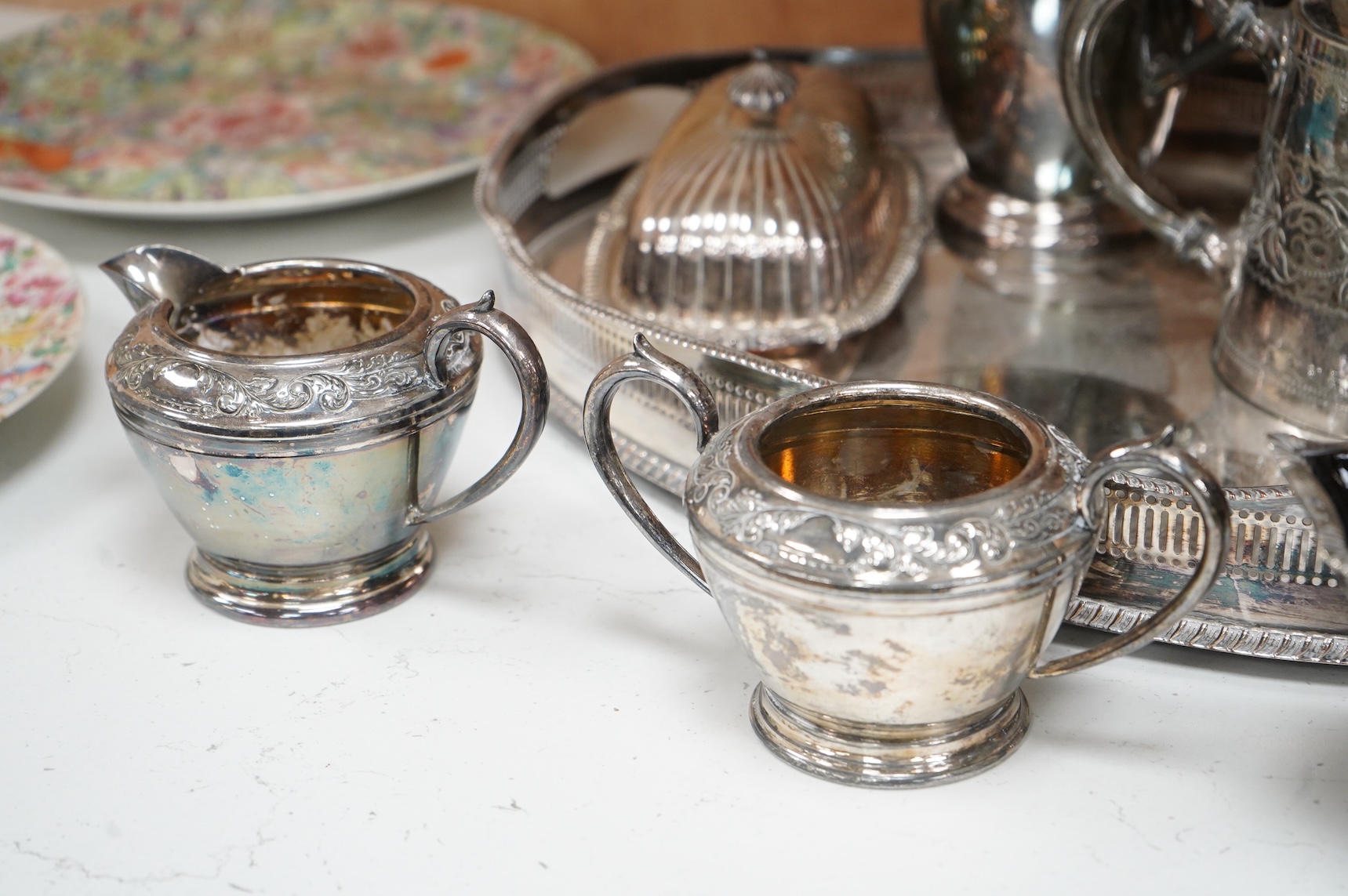 A quantity of plated wares to include a galleried tray, teapot, jug and bon bon dish with glass liner, largest 45cm wide